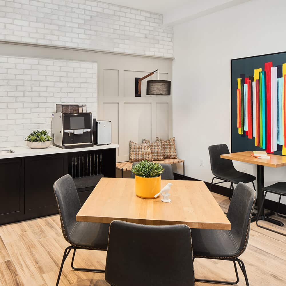 Rustic farmhouse amenity office space with large work desks