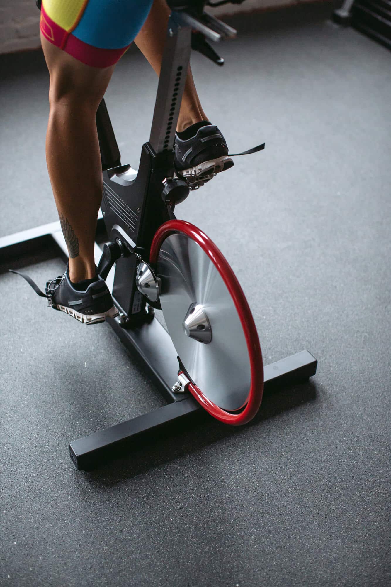 A resident cycling on an exercise bike in a fitness center